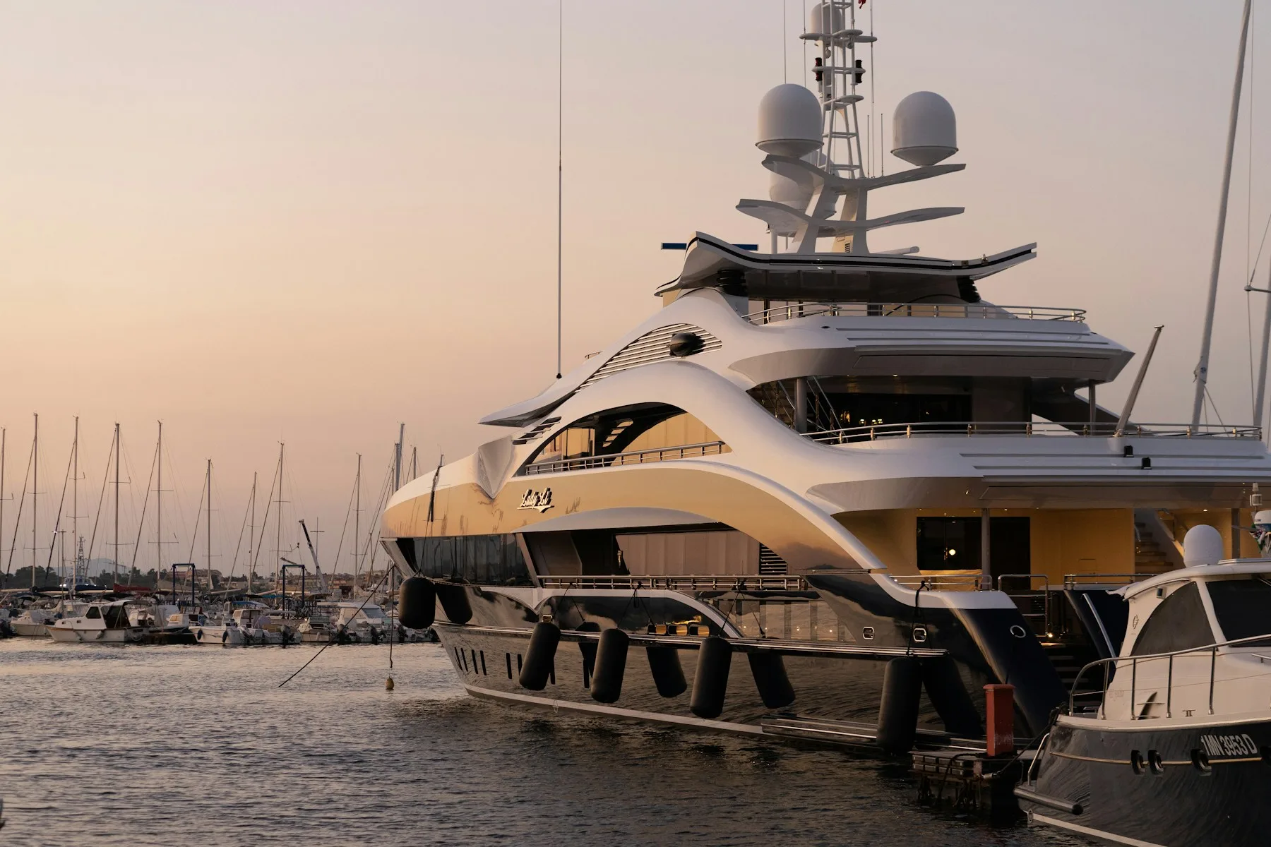 Luxury yacht at anchor in clear water