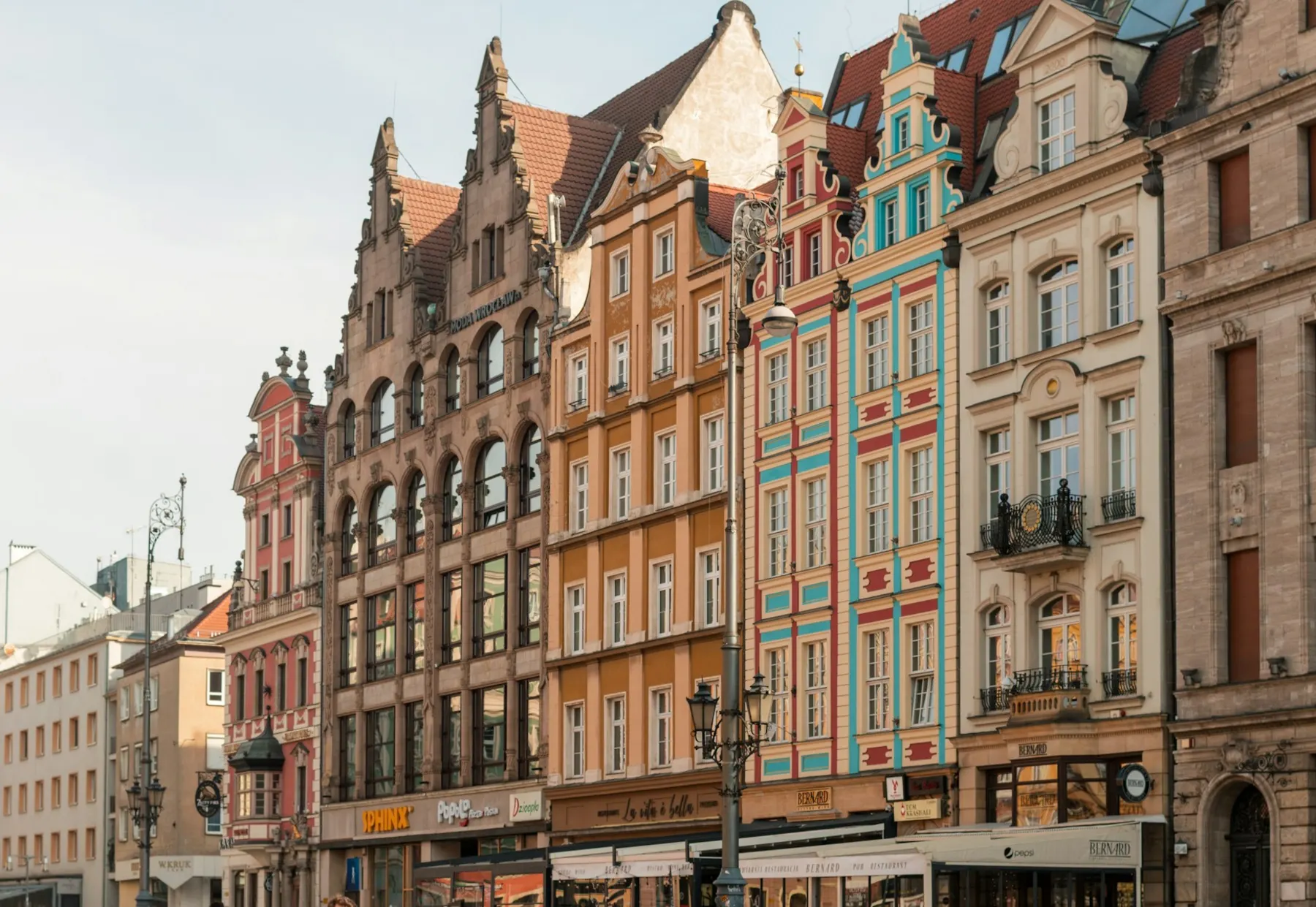 Ornate colourful historic buildings lining a European city street